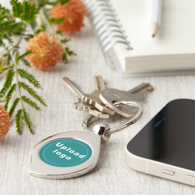 Logo With Teal Green Background on Swirl Metal Key Ring (Side)
