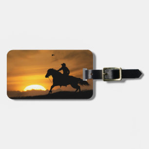 Lone Riding Cowboy in the Sunset Luggage Tag