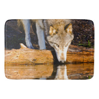 Lone Wolf Reflection in Pond Bath Mat