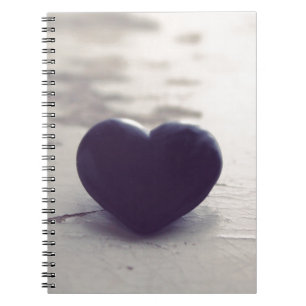 Lonely Purple Stone Heart on a Wet Sandy Beach Notebook