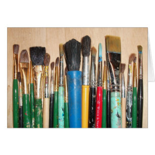 Lots of Colourful Used Artist Paintbrushes in a Ro