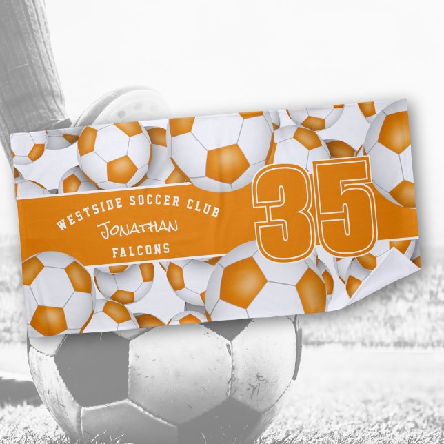 Lots of soccer balls orange white team colours beach towel (Creator Uploaded)