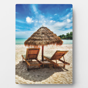 Lounge chairs on beach throw pillow plaque