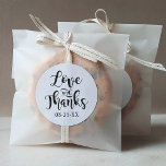 Love and Thanks Black Handwritten Script Wedding Classic Round Sticker<br><div class="desc">Modern wedding "Love is Thanks" quote stickers feature a modern black and white colour scheme with bold and playful handwritten calligraphy script typography with stylish scroll details. Personalise with your wedding date. A perfect accent for your casual wedding day.</div>