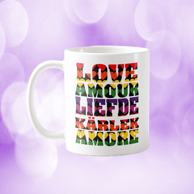 Love in Many Languages Dark Rainbow Coffee Mug (A mug that says love in a variety of languages with rainbow hearts.)