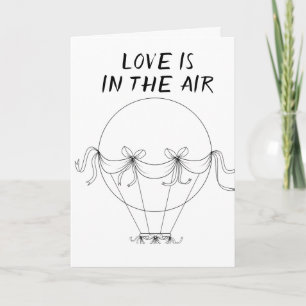 **LOVE** IS IN THE AIR **ON OUR ANNIVERSARY** CARD