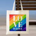 Love Is love Pride<br><div class="desc">This Pride Tote Bag is decorated with LOVE IS LOVE in bold white letters on a watercolor rainbow background of red,  orange,  yellow,  green,  blue,  and purple.
Original Watercolor © Michele Davies.</div>