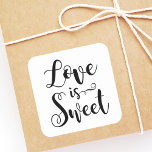Love is Sweet Black Handwritten Script Wedding Square Sticker<br><div class="desc">Modern wedding "Love is Sweet" quote stickers feature a modern black and white colour scheme with bold and playful handwritten calligraphy script typography with stylish scroll details. A perfect accent for your casual wedding day.</div>