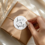 Love is Sweet Modern Black Heart Script Wedding Classic Round Sticker<br><div class="desc">Elegant custom wedding favour tags feature a modern heart calligraphy script "Love is Sweet" design. Black and white colours can be modified.</div>