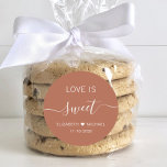 Love Is Sweet Terracotta Wedding Favour Classic Round Sticker<br><div class="desc">Boho chic terracotta sticker for your wedding candy favours featuring "love is sweet" in simple white lettering and an elegant white script with swashes,  your first names joined together by a heart and your wedding date.</div>