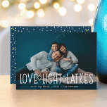 Love, Light & Latkes | Hanukkah Photo Card<br><div class="desc">Cute and lighthearted Hanukkah photo card features your favorite horizontal or landscape oriented photo with "love,  light,  latkes" overlaid in white lettering accented with stars of David. Personalize with your Hanukkah greeting,  names and the year beneath. Cards reverse to a pattern of snow and stars on dark blue.</div>