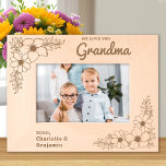Love you Grandma Floral Personalised Wood Picture<br><div class="desc">Cherish Every Moment with Grandma Introducing the Personalised Etched Wood Frame, a beautiful way to celebrate the special bond between grandchildren and their beloved grandma. This exquisite wooden picture frame is adorned with delicate floral designs etched into each corner, creating a charming and timeless aesthetic that complements any photo. Features...</div>