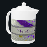 Love You Grandma Modern Paint Splatter Abstract<br><div class="desc">This personalised teapot offers grandma a vibrant design to wake her up in the morning or add a splash of colour to her afternoon tea. This artistic teapot features purple and yellow paint splatters against a silver background. A grey banner across the centre provides a solid background for "We Love...</div>