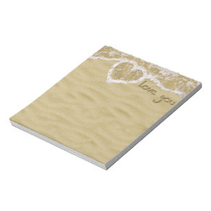 "Love you" written in Sand - Notepad