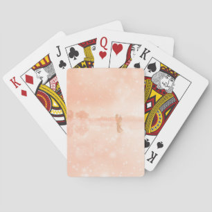 Lovers on a frozen pond playing cards