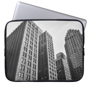 LOW ANGLE GRAYSCALE PHOTOGRAPHY OF HIGH-RISE BUILD LAPTOP SLEEVE