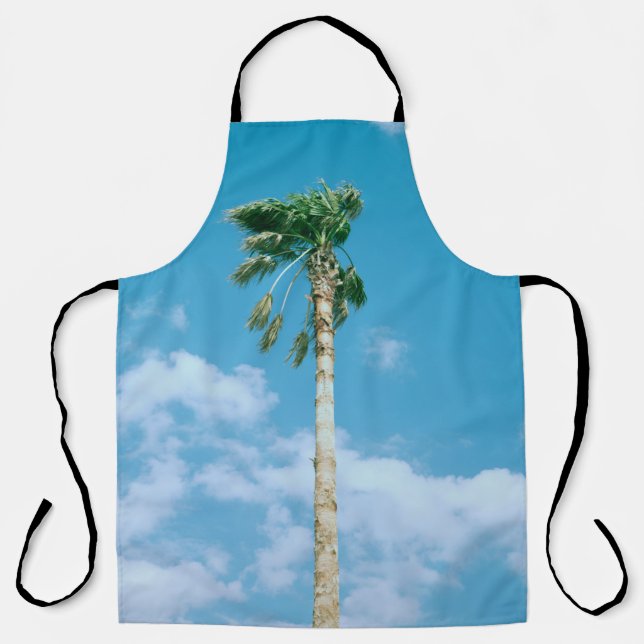 Low-angle photo of palm trees under blue sky apron (Front)