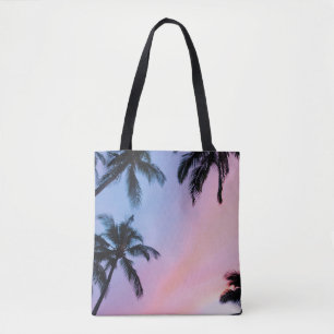 Low-angle photography coconut trees during golden tote bag