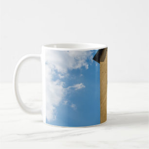 LOW ANGLE PHOTOGRAPHY OF BROWN LOUVER WINDOW COFFEE MUG