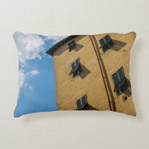 LOW ANGLE PHOTOGRAPHY OF BROWN LOUVER WINDOW DECORATIVE CUSHION