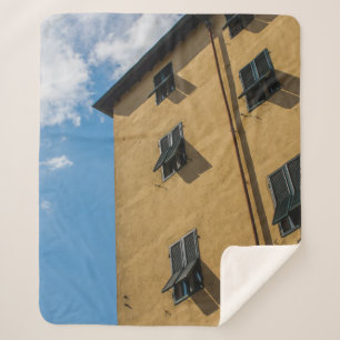 LOW ANGLE PHOTOGRAPHY OF BROWN LOUVER WINDOW SHERPA BLANKET