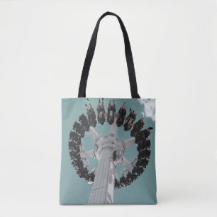 Low-angle photography of people riding a drop-down tote bag