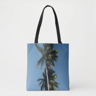 Low angle photography of three coconut trees tote bag