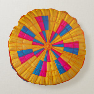 Low angle photography of yellow, pink, and black h round cushion