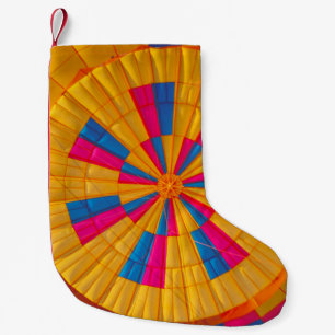 Low angle photography of yellow, pink, and black h small christmas stocking