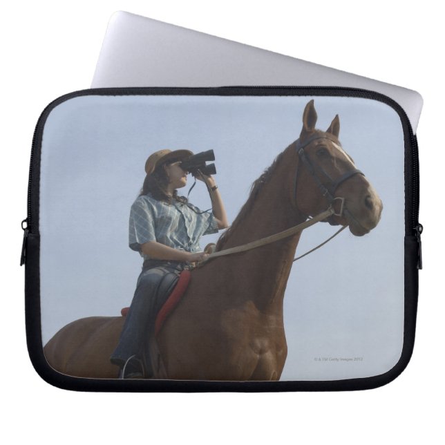 Low angle view of a teenage girl riding a horse laptop sleeve (Front)