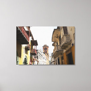 Low angle view of apartments along the street canvas print