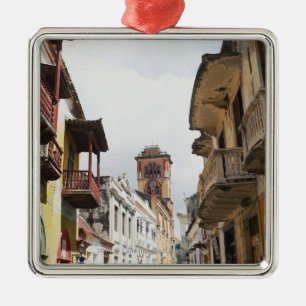 Low angle view of apartments along the street metal tree decoration