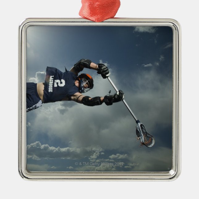 Low angle view of jai-alai player jumping metal tree decoration (Front)