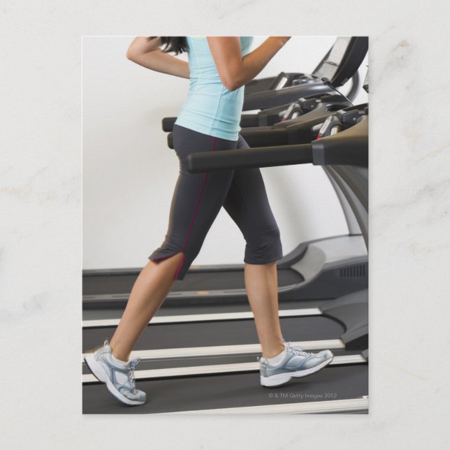 Low section of woman walking on treadmill postcard (Front)