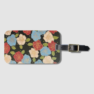Luggage tag with blues, pinks, green and gold