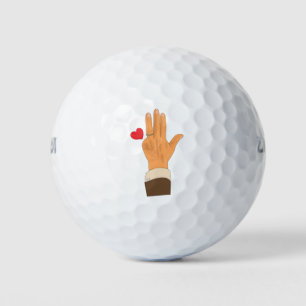 Lula's left hand and a heart golf balls