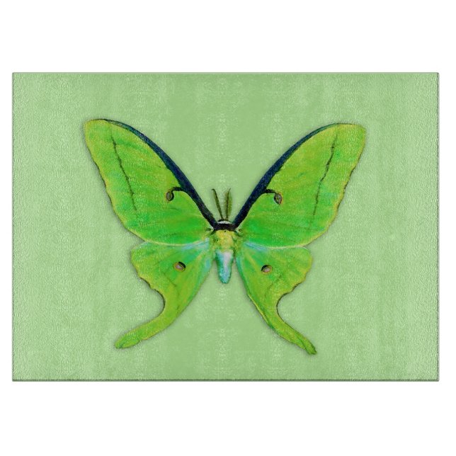 Luna moth on a pale green background cutting board (Front)
