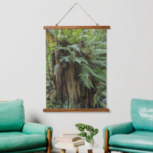 Lush Ferns Growing on Tree Stump Hanging Tapestry