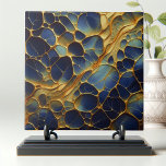 Luxurious Deep Navy Blue Gold Abstract Organic  Tile<br><div class="desc">This captivating decorative ceramic tile boasts an abstract design reminiscent of organic cellular structures or intricate patterns found in nature. The interlocking shapes resemble cross-sections of plant cells or honeycomb, transitioning from deep navy blues to golden hues. The golden outlines add a luxurious touch against the darker background. It’s perfect...</div>