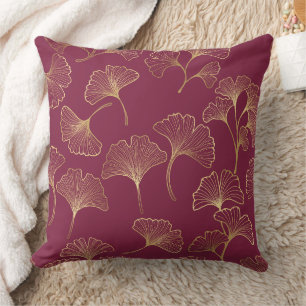 Luxurious Gold Ginkgo Leaves on Deep Burgundy Cushion
