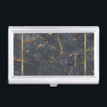 Luxury black and gold marble texture business card holder<br><div class="desc">Image of luxury black and gold marble texture with gold stripe accent. Customisable monogram,  embossed look.</div>