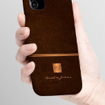 Luxury elegant gold glitter brown monogrammed iPhone 16 case<br><div class="desc">Classy exclusive looking office or personal monogrammed phone case featuring a faux copper metallic gold glitter square with your monogram name initials and a sparkling stripe over a stylish dark brown faux leather background. Suitable for small business, corporate or independent business professionals, personal branding or stylists specialists, makeup artists or...</div>