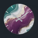 Luxury Gold Glitter Marble Pattern Round Clock<br><div class="desc">Soft flowing waves of teal and deep purple blend together with shimmering gold sparkles. A stylish abstract pattern with a modern and luxurious feel.</div>
