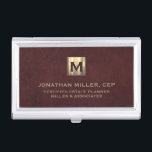 Luxury Gold Initial Logo Oxblood Leather Business Card Holder<br><div class="desc">Simple modern luxury design with brushed metallic gold initial logo medallion with personalised name,  title,  company name or custom text below in classic block typography on a oxblood red leather textured background. Personalise for your custom use.</div>