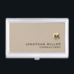 Luxury Gold Monogram Beige Business Card Holder<br><div class="desc">Simple modern design with luxury brushed metallic gold monogram medallion with personalised name and title or custom text below in classic block typography on a solid beige background. Personalise for your custom use.</div>
