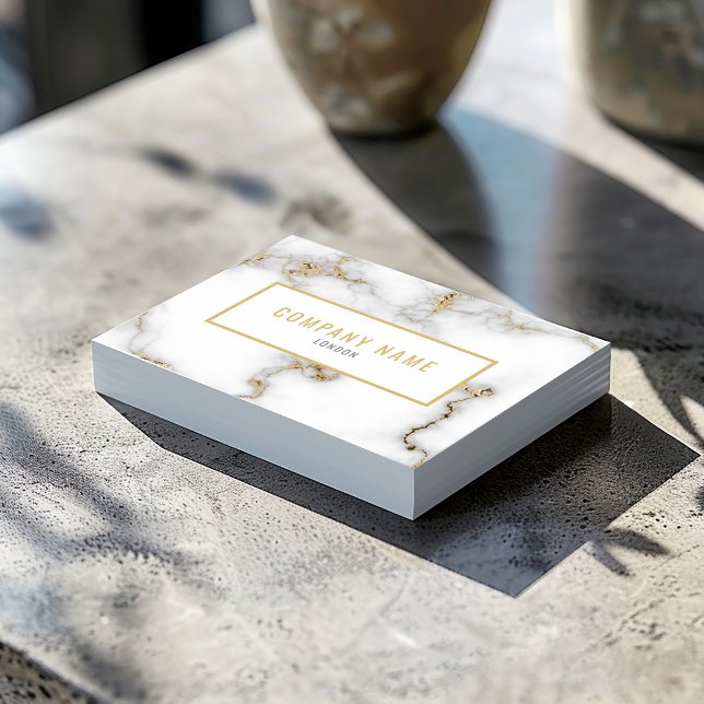 Luxury white and gold marble effect business card (White marble business card with gold name, minimalist contact details, and gold frame.)