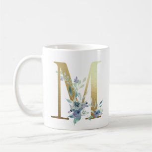 M, golden initial with blue floral foliage coffee mug