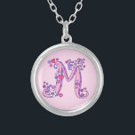 M monogram decorative letter necklace<br><div class="desc">Pretty letter M monogram pendant. Whimsical letter drawing of the capital initial letter M,  ideal for gifting girls with a name that begins with M. Background colour can be changed if required,  currently light pink. © Original drawing and design by Sarah Trett www.sarahtrett.com for www.mylittleeden.com</div>