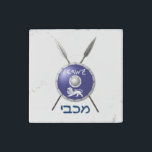 Maccabee Shield And Spears Stone Magnet<br><div class="desc">A depiction of a Maccabee's shield and two spears. The shield is adorned by a lion and text reading "Yisrael" (Israel) in the Paleo-Hebrew alphabet. "Maccabee" also appears in modern Hebrew. The Maccabees were Jewish rebels who freed Judea from the yoke of the Seleucid Empire. Chanukkah is not just a...</div>