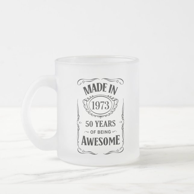 Made in 1973 50 years of being awesome 2023 bday frosted glass coffee mug (Left)